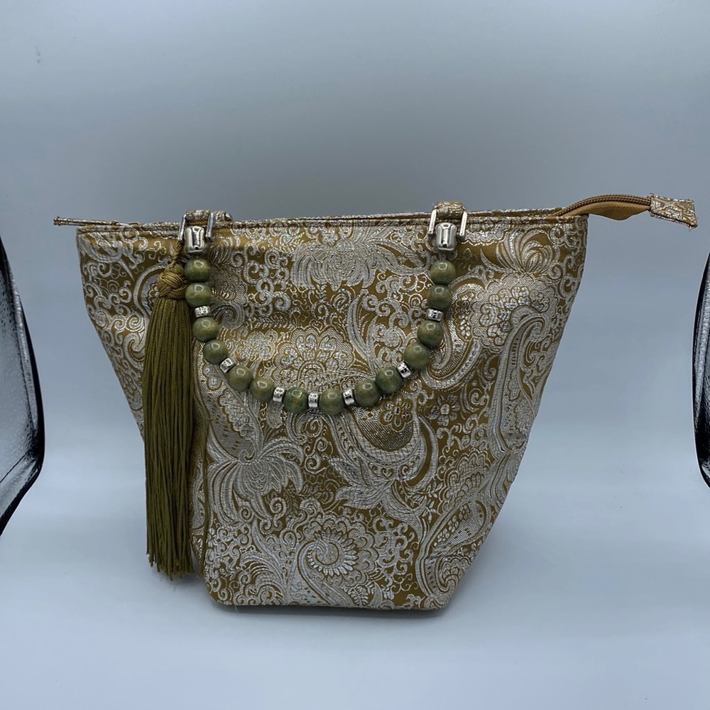 Braciano gold metallic with olive green beaded handle. Medium